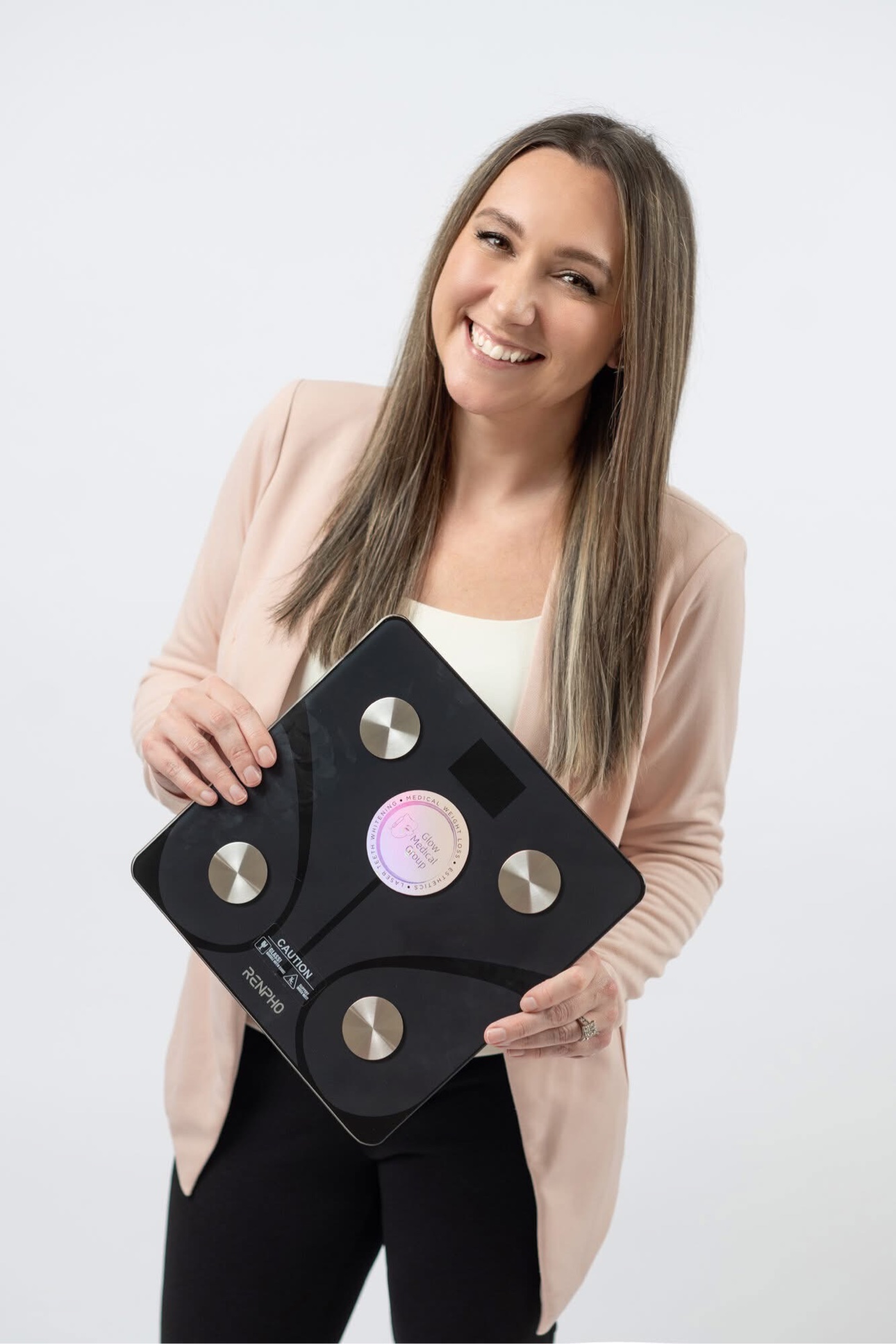 Sarah Jones with the RENPHO smart scale used in Glow's medical weight loss program