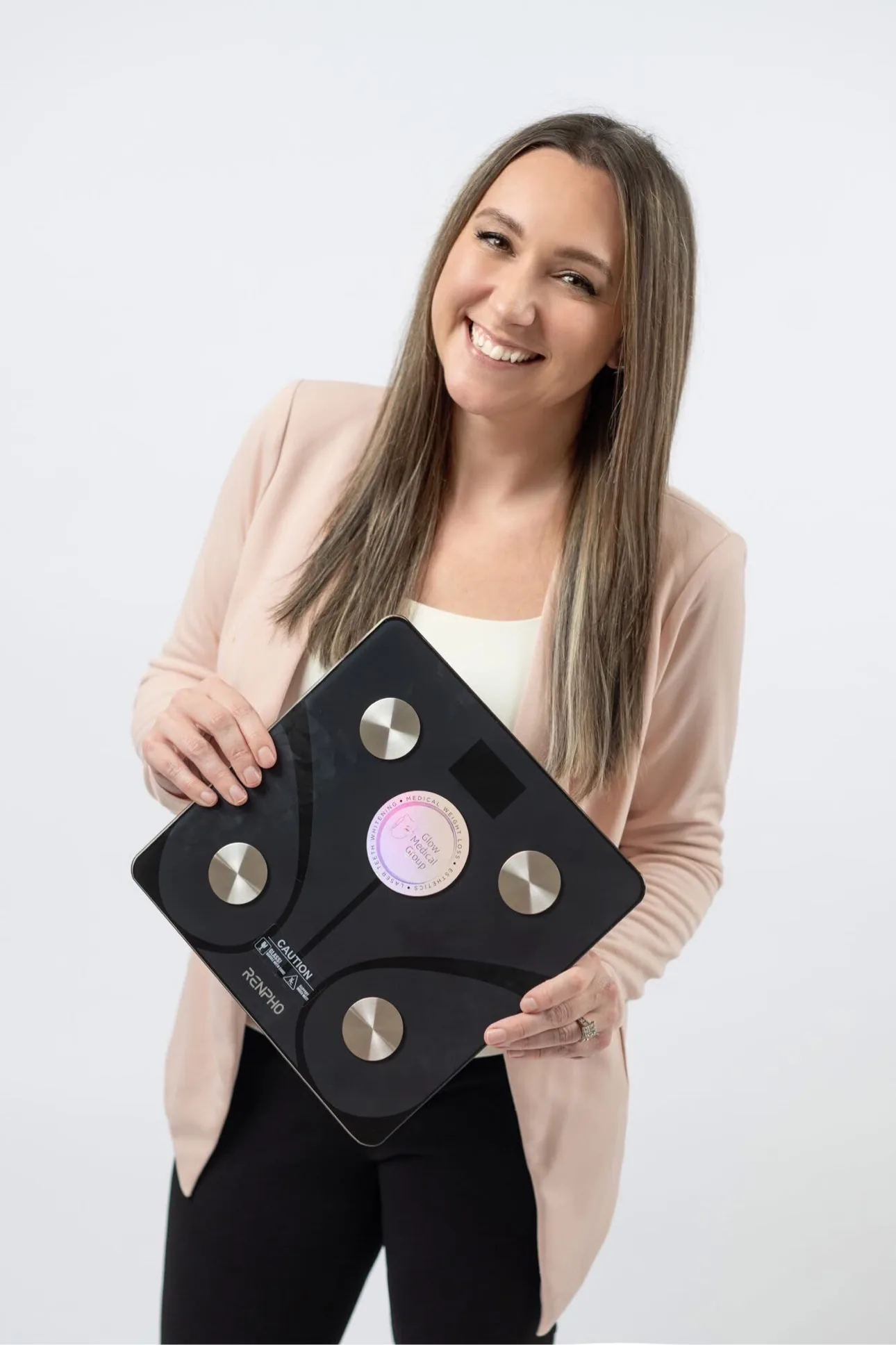 Sarah Jones with the RENPHO smart scale used in Glow's medical weight loss program